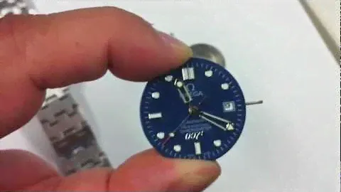 Inside a replica Omega Seamaster.  Poor quality inside.
